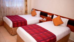 Tempat tidur dalam kamar di Sheratton Regency Hotel Nairobi