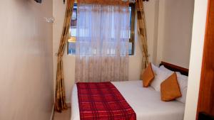 Tempat tidur dalam kamar di Sheratton Regency Hotel Nairobi