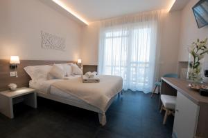 Postel nebo postele na pokoji v ubytování Brichett Deluxe Rooms