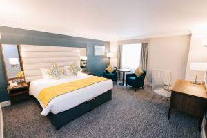 Giường trong phòng chung tại Grand Hotel