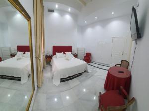 Posteľ alebo postele v izbe v ubytovaní Apartamento Tendillas