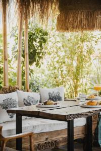 a table with plates of food on top at Empire Beach Resort ADULTS ONLY in Dhërmi