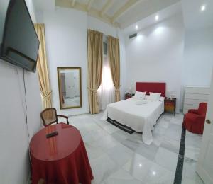 Posteľ alebo postele v izbe v ubytovaní Apartamento Tendillas