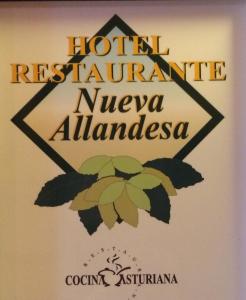a sign for the hotel restaurant nivea almanac at Hotel Nueva Allandesa in Pola de Allande