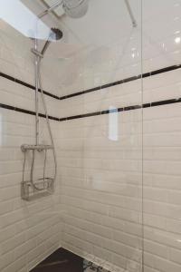 a shower with a glass door in a bathroom at 1 bedroom 1 bathroom furnished - Chueca - bright in downtown area - MintyStay in Madrid