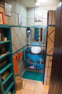 a bathroom with a sink and a mirror at VILLA VOLUBILIS in Monserrat