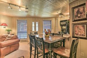 a kitchen and dining room with a table and chairs at Walk to Ski and Trails All-Season Angel Fire Escape in Angel Fire