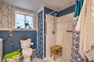 a bathroom with a toilet and a shower at Historic Cottage on Horse Farm FirePit and BBQ in Milbridge