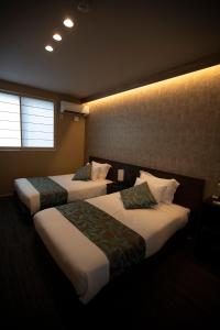 Tempat tidur dalam kamar di Hotel Sengokuhara 533