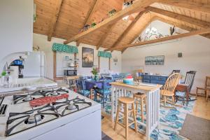 a kitchen and dining room with a stove top oven at Historic Cottage on Horse Farm FirePit and BBQ in Milbridge +17 photos