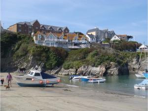 a group of boats docked on the beach at Harbour Hotel in Newquay