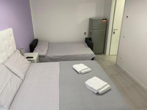 Posteľ alebo postele v izbe v ubytovaní Stadio 1 - Appartamenti monolocali con bagno privato Verona