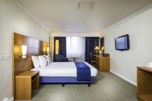a hotel room with two beds and a television at Holiday Inn Brentwood, an IHG Hotel in Brentwood