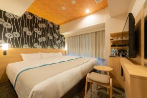Voodi või voodid majutusasutuse Tosei Hotel Cocone Ueno Okachimachi toas