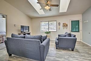 a living room with two couches and a ceiling fan at Moms Place in Jemez - 1 Mi to Hot Spring in Jemez Springs