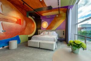 Postel nebo postele na pokoji v ubytování Art Hotel Pallas by Tartuhotels