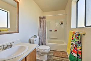a bathroom with a sink and a toilet and a shower at Moms Place in Jemez - 1 Mi to Hot Spring in Jemez Springs +22 photos