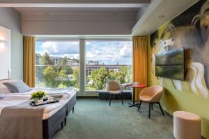 Postel nebo postele na pokoji v ubytování Art Hotel Pallas by Tartuhotels
