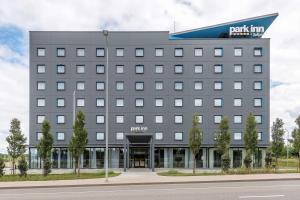 a rendering of the front of a building at Park Inn by Radisson Vilnius Airport Hotel & Conference Centre in Vilnius