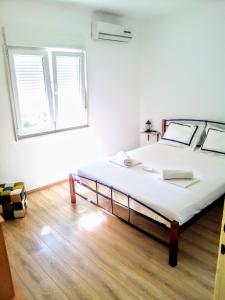 Postel nebo postele na pokoji v ubytování Maja rooms