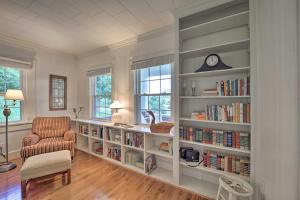 a living room with book shelves filled with books at Abingdon Family Getaway with Porch and Views! in Abingdon