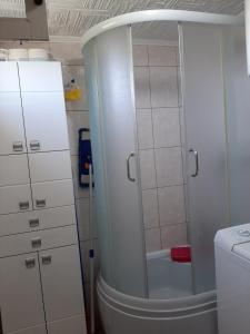 a bathroom with a shower and a white cabinet at Holiday Home Stella in Vrdnik +36 photos