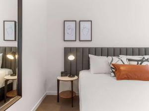 A bed or beds in a room at The Sebel Melbourne Moonee Ponds
