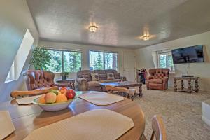 a living room with a table with a bowl of fruit on it at Scenic Duck Creek Escape 30 Mi to Brian Head in Duck Creek Village