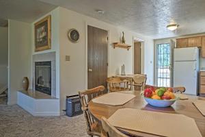 a kitchen and dining room with a table with a bowl of fruit at Scenic Duck Creek Escape 30 Mi to Brian Head in Duck Creek Village