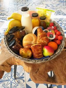 a basket of breakfast foods on a table at Urban Lodge Hotel in Amsterdam