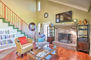 a living room with a fireplace and a tv at Hilltop Home in Wine Country with Hot Tub and Views! in Fallbrook