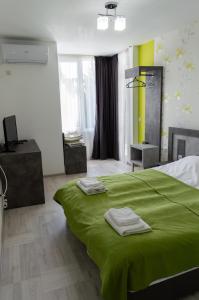 Кровать или кровати в номере Стаи за гости ValenDa