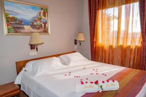 Postel nebo postele na pokoji v ubytování Java Hotel