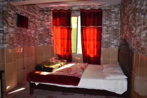 Gulta vai gultas numurā naktsmītnē Musyari Guest House