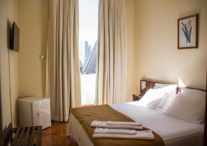 Cama ou camas em um quarto em Hotel Carioca