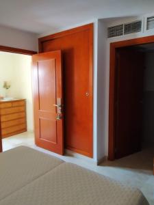 a bedroom with a bed and a door at My Rooms Manacor Centre by My Rooms Hotels in Manacor