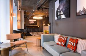 a living room with a couch and a table at The Chamberlain in London