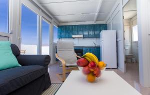 a bowl of fruit on a table in a living room at Arinaga Colors, tu casa en la playa in Arinaga