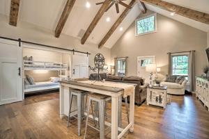 a kitchen and living room with a bunk bed at Hootenanny at Horton Creek Creekside Escape! in Helen