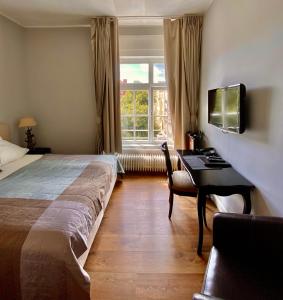Postel nebo postele na pokoji v ubytování Das Nikolai Hotel
