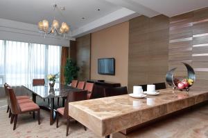 a dining room with a large table and chairs at Crowne Plaza Nanjing Jiangning, an IHG Hotel in Nanjing