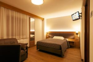 Postel nebo postele na pokoji v ubytování Albergo Antelao