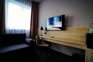TV a/nebo společenská místnost v ubytování Hotel Viktorosa