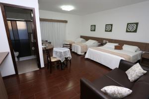 Postel nebo postele na pokoji v ubytování Hotel Schroeder