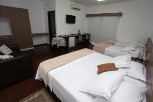 Postel nebo postele na pokoji v ubytování Hotel Schroeder