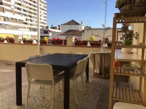 a black table and chairs on a balcony at Estuhome in Madrid