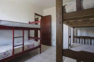 Katil atau katil-katil dalam bilik di Cobertura Duplex na Prainha com Churrasqueira