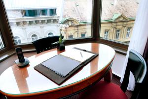 a table in a room with a window at Sofitel Budapest Chain Bridge in Budapest