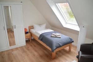 Letto o letti in una camera di Hotel Südstrand Amrum