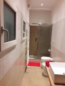 a bathroom with a shower and a toilet and a sink at La Casa Nel Verde 2 in Bologna